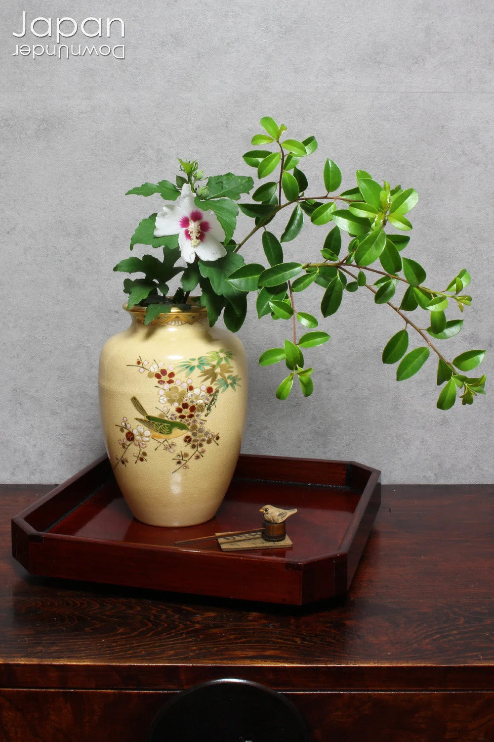 Infuse your space with refined charm through this glossy vintage Japanese lacquer tray - an exquisite fusion of traditional artistry and modern design. Poised gracefully on sculptural walnut shell legs, this distinctive piece is both functional and decorative, perfect for serving or showcasing your cherished treasures.