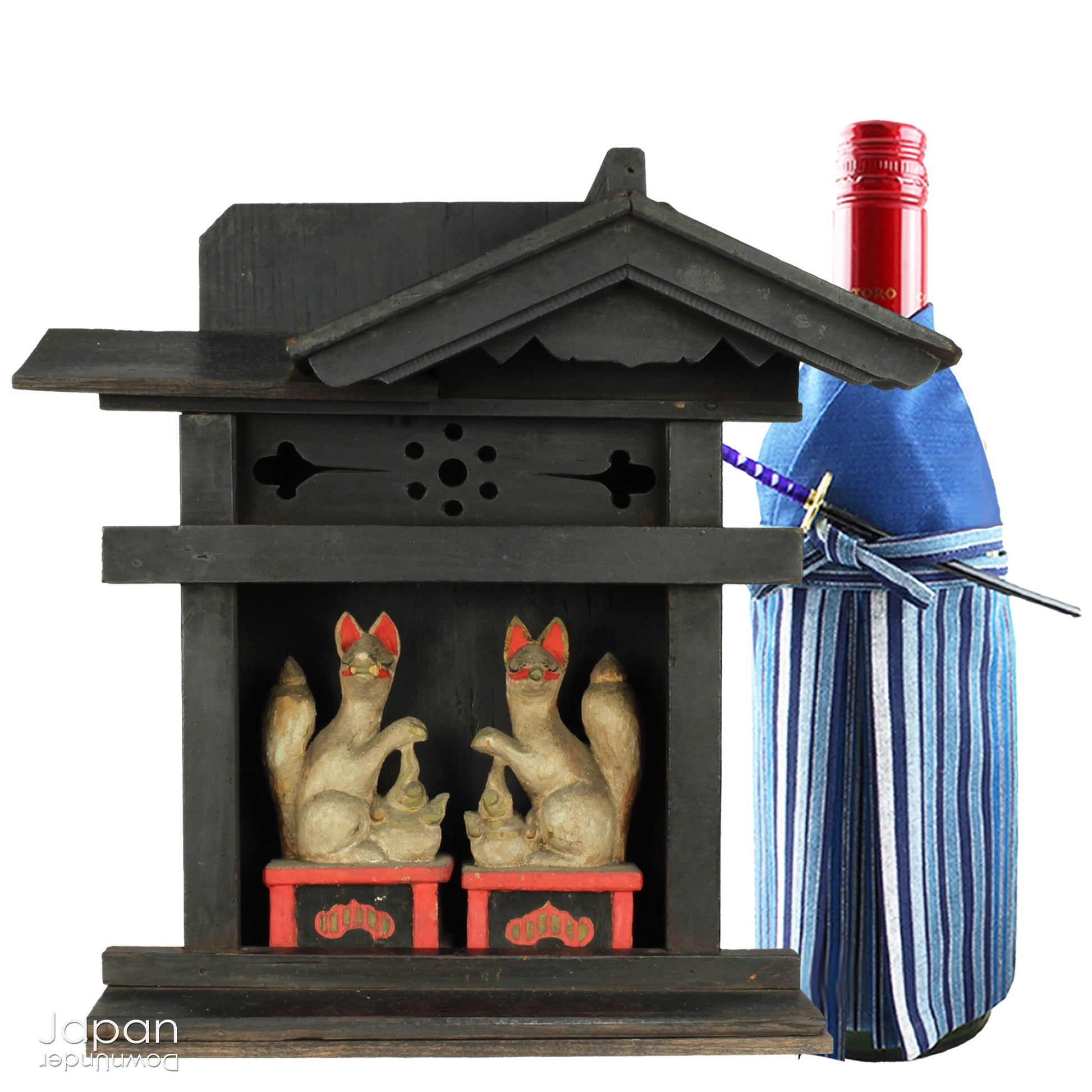 This charming Edo-period Shinto shrine is a rare and beautiful find - an authentic piece once cherished in a traditional Japanese country home. It originally held pride of place on the kamidana (god shelf), serving as a sacred site for daily offerings and prayers. Nestled within are a pair of hand-carved Inari foxes - protective spirits known to bring fortune, fertility, and blessings.