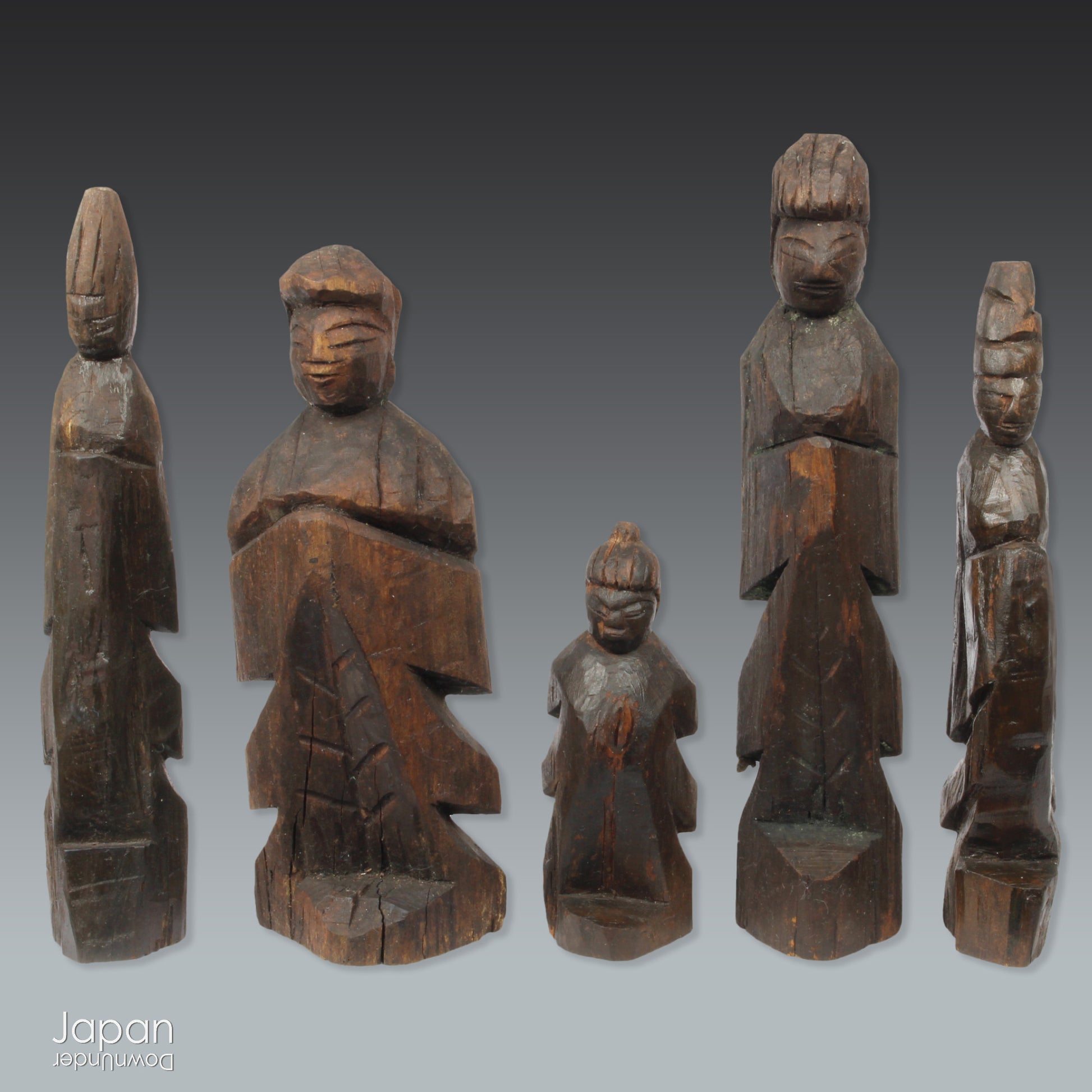 A collection of old hand-carved Enku-style Buddha and Kannon statues.  Enku was a Buddhist monk, much loved for his simple, folk art statues, carved during his many pilgrimages  to the mountains.  These old carvings are made of a light wood.