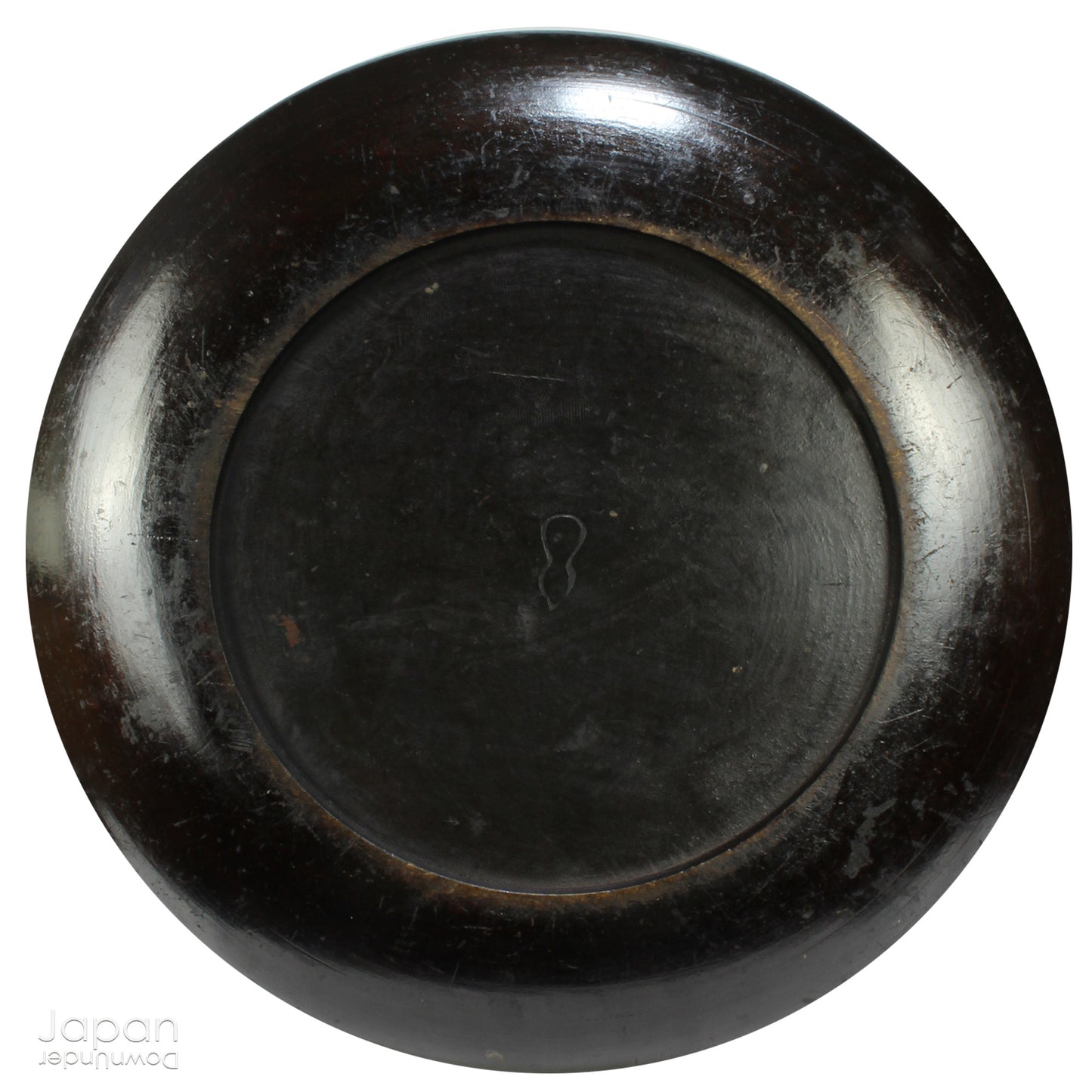 A stunning 1800’s Japanese folk art round serving tray. This versatile piece doubles as a unique display stand adding a touch of rustic charm to any decor. The beautiful dark wine red and black color palette showcases the wonderful patina of use, making it a truly one-of-a-kind art object.