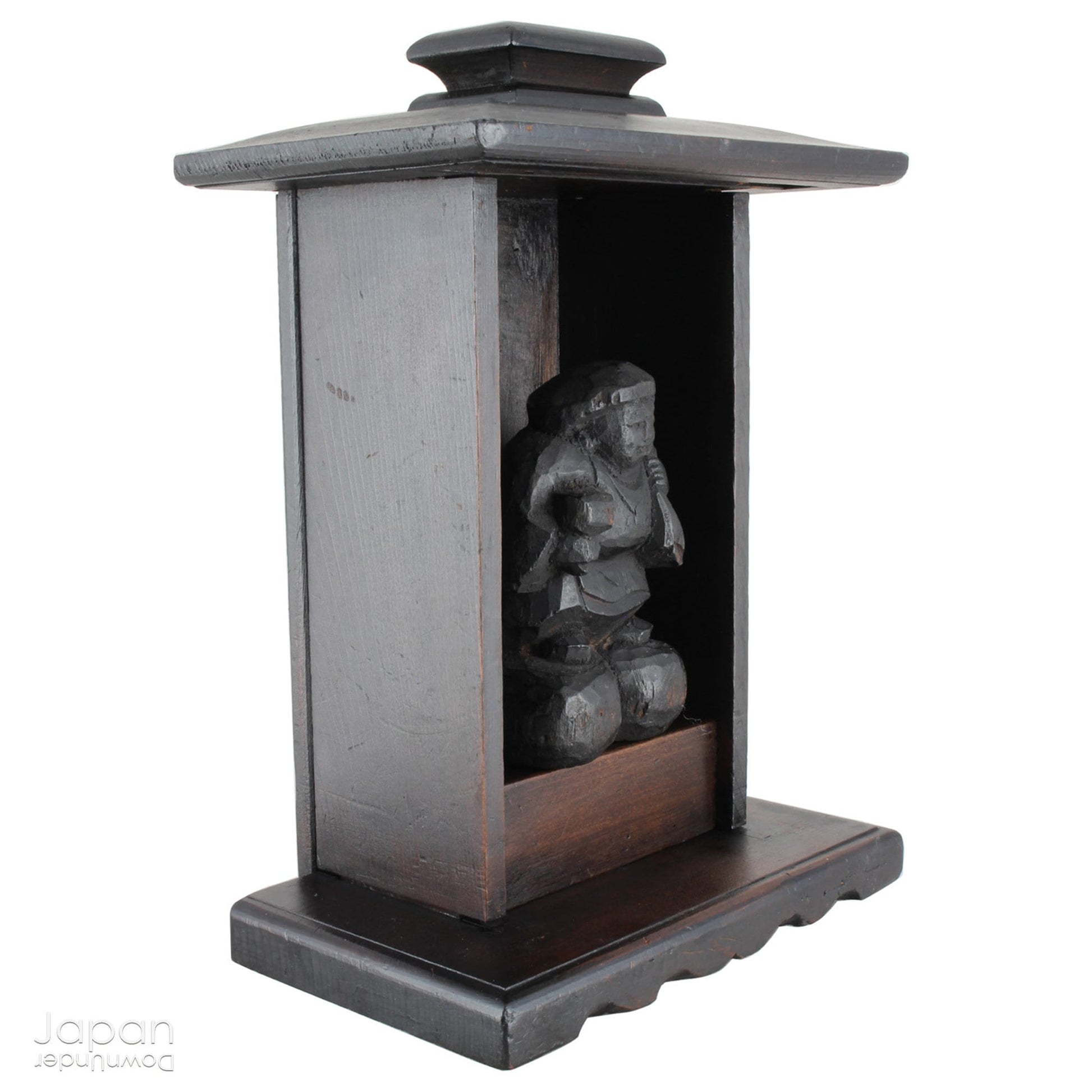 A perfect addition to your spiritual space, this quaint rustic antique Shinto shrine, made to be placed on the kamidana (god shelf), houses the lucky god Daikoku. The charming hand crafted god house embodies the essence of Shinto folk faith, creating an atmosphere of serenity in your home. A meaningful decor piece, that not only celebrates traditional Japanese beliefs but also invites blessings into your home.