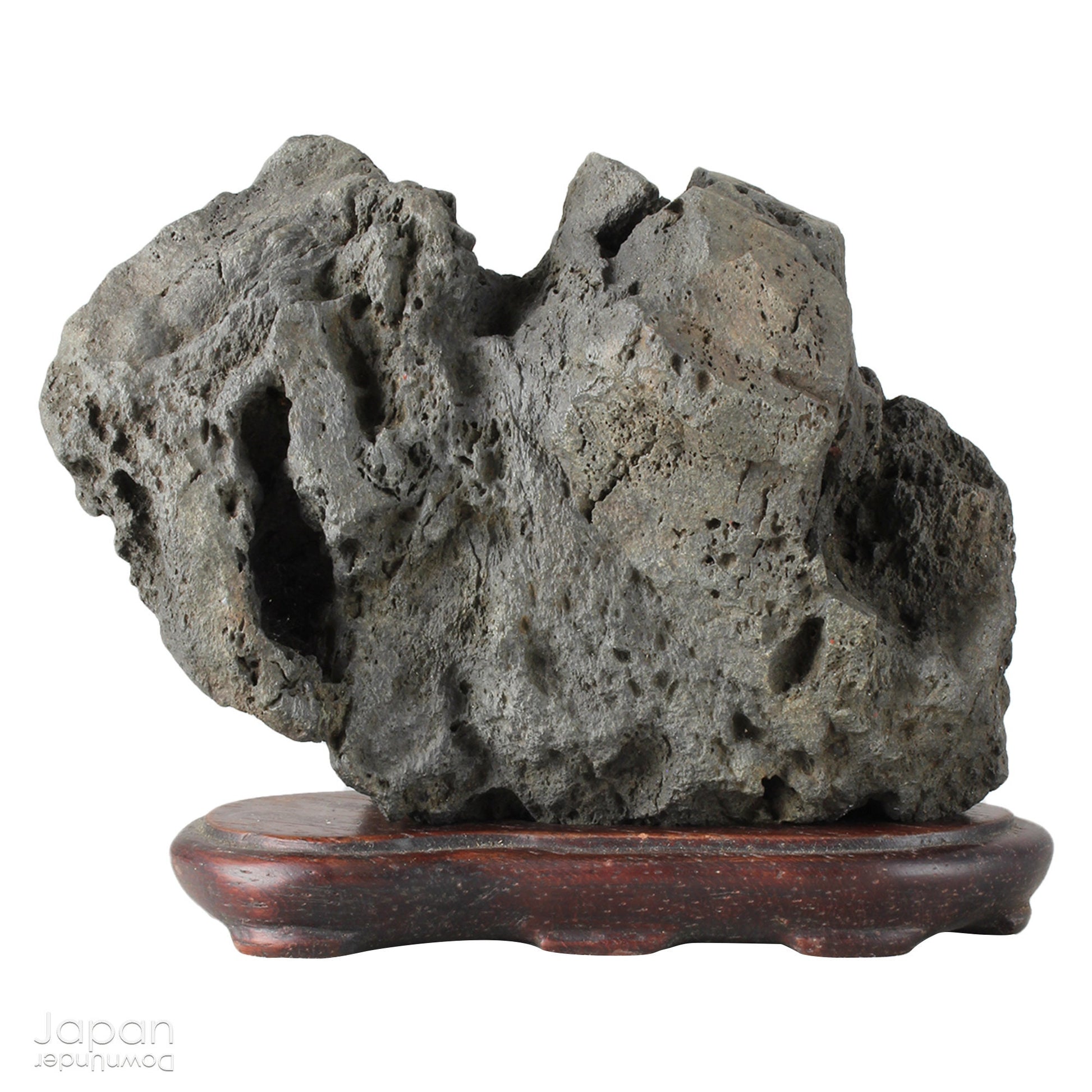 Infuse your interior with the quiet power of nature through this evocative vintage Japanese suiseki. Cradled on a finely hand-carved wooden daiza (stand), this stone exudes a meditative stillness - an ideal focal point for spaces designed for reflection, mindfulness, or artistic appreciation.