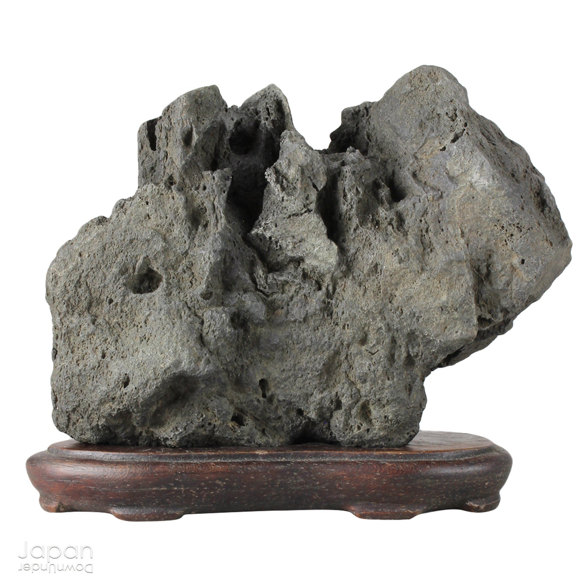 Infuse your interior with the quiet power of nature through this evocative vintage Japanese suiseki. Cradled on a finely hand-carved wooden daiza (stand), this stone exudes a meditative stillness - an ideal focal point for spaces designed for reflection, mindfulness, or artistic appreciation.