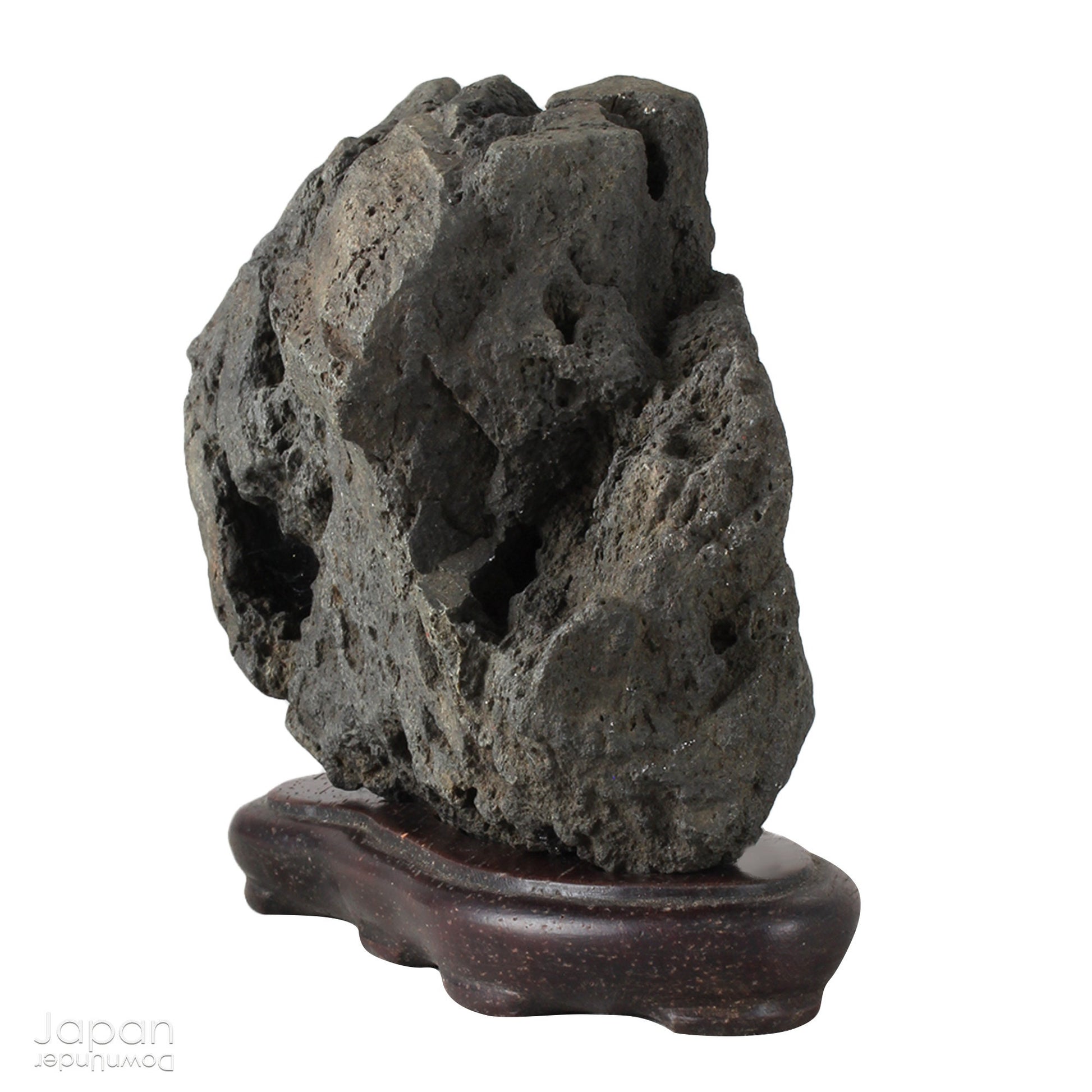 Infuse your interior with the quiet power of nature through this evocative vintage Japanese suiseki. Cradled on a finely hand-carved wooden daiza (stand), this stone exudes a meditative stillness - an ideal focal point for spaces designed for reflection, mindfulness, or artistic appreciation.