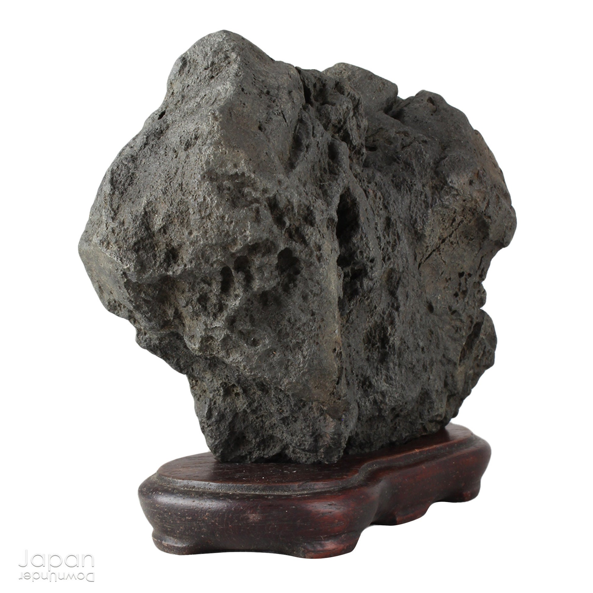 Infuse your interior with the quiet power of nature through this evocative vintage Japanese suiseki. Cradled on a finely hand-carved wooden daiza (stand), this stone exudes a meditative stillness - an ideal focal point for spaces designed for reflection, mindfulness, or artistic appreciation.