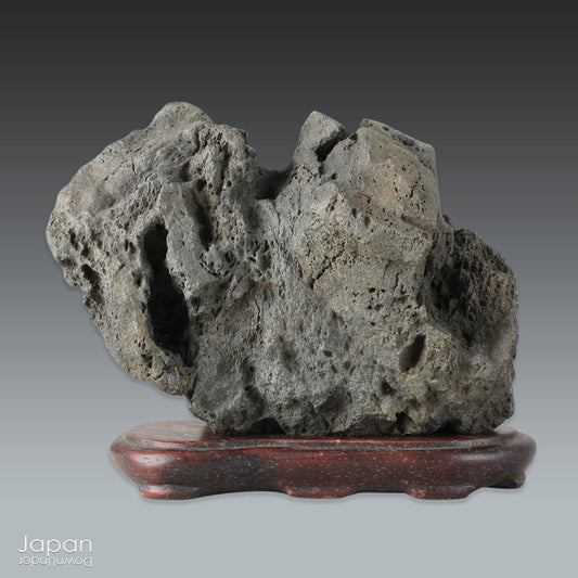 Infuse your interior with the quiet power of nature through this evocative vintage Japanese suiseki. Cradled on a finely hand-carved wooden daiza (stand), this stone exudes a meditative stillness - an ideal focal point for spaces designed for reflection, mindfulness, or artistic appreciation.