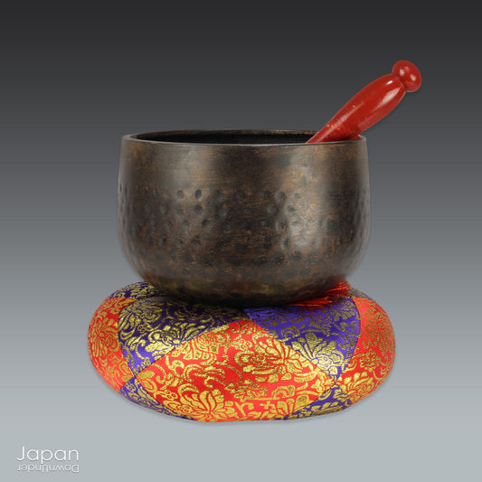 A Japanese orin from a Buddhist temple. The set includes a zabuton cushion, a singing bowl and a rinbo or striker. Orin like this are placed on the offering table, for prayer and worship,  in the main hall, where the object of worship is enshrined.