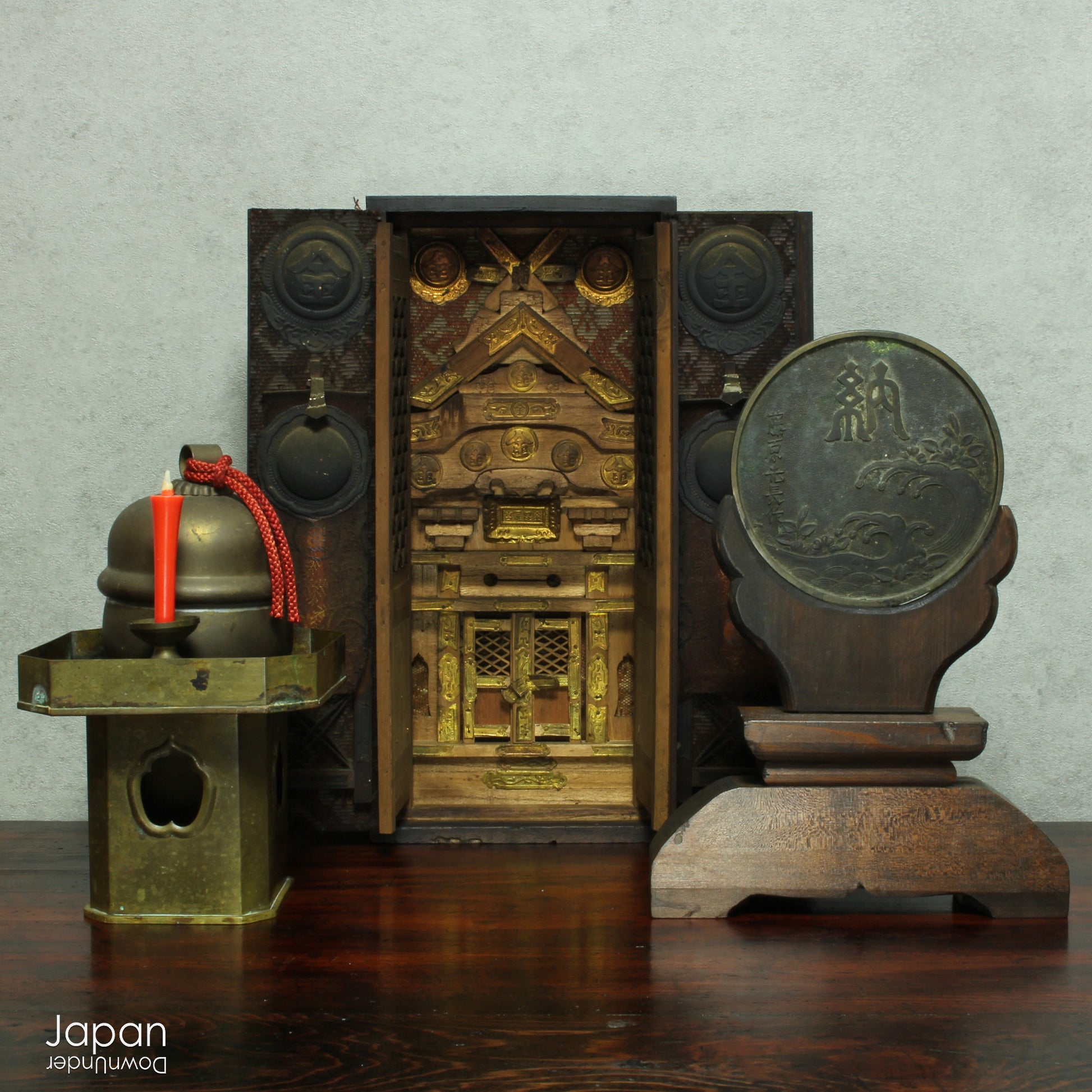 Infuse your spiritual setting with history and reverence through this traditional Japanese Shinto home altar mirror, or shinkyo, set within a hand-carved wooden stand. Once placed on the kamidana - the household altar of a historic Japanese home - this piece carries a deep sense of presence and cultural heritage.