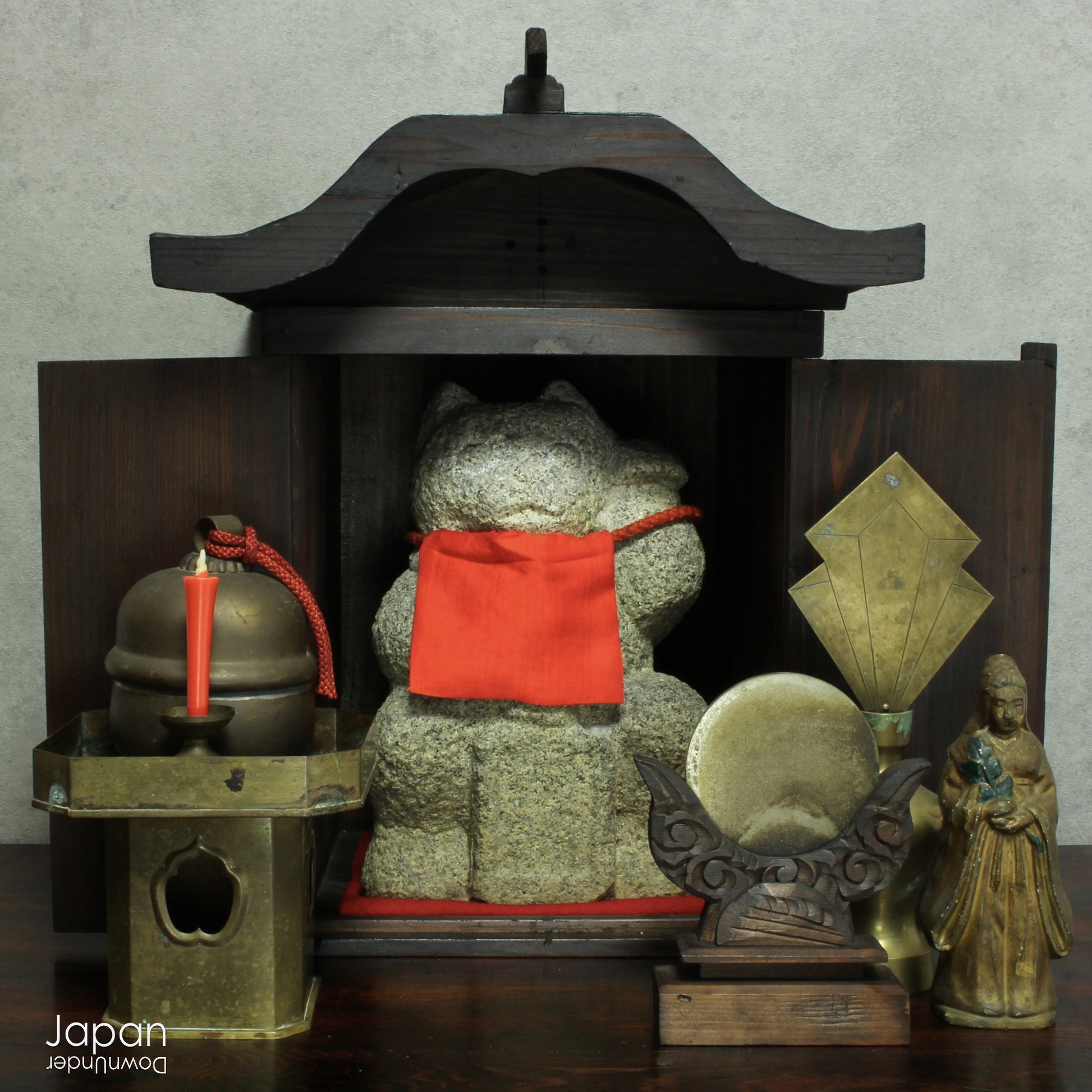 Infuse your spiritual setting with history and reverence through this traditional Japanese Shinto home altar mirror, or shinkyo, set within a hand-carved wooden stand. Once placed on the kamidana - the household altar of a historic Japanese home - this piece carries a deep sense of presence and cultural heritage.