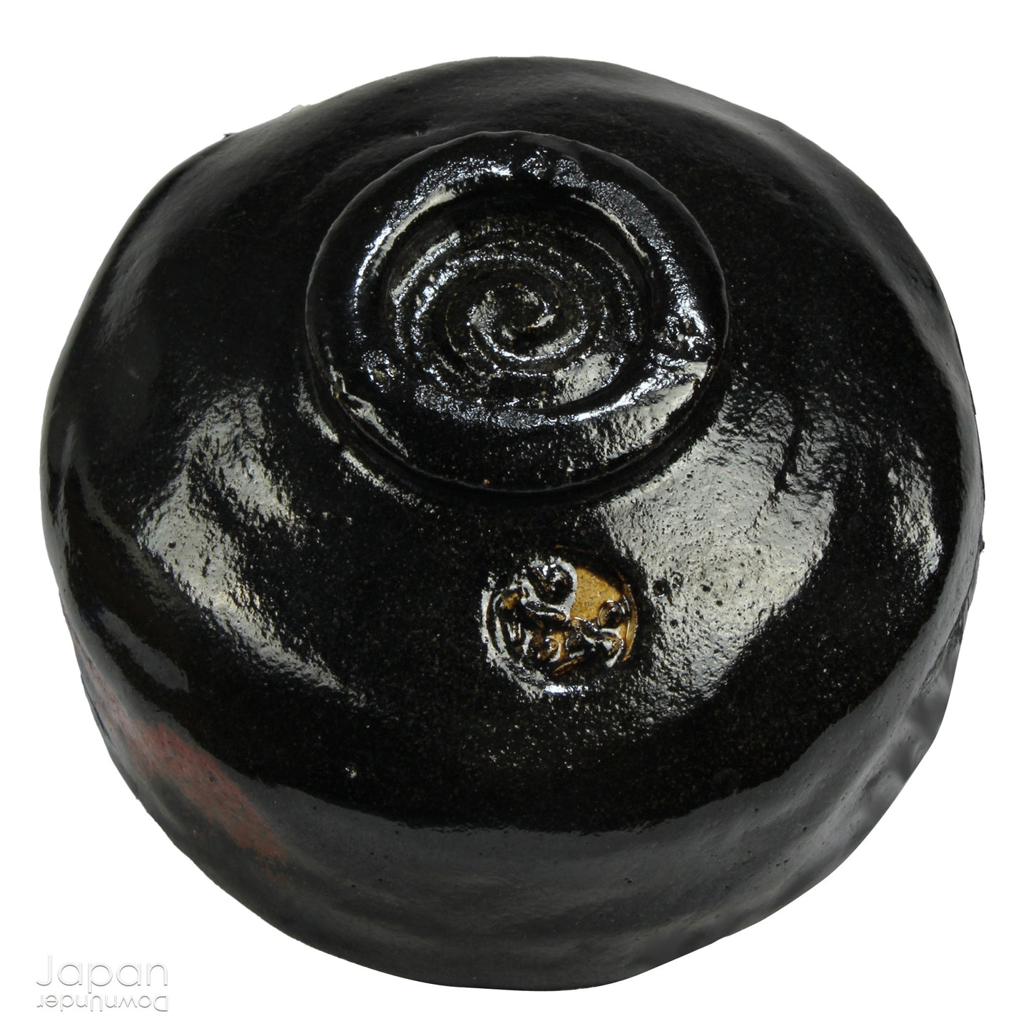 Elevate your tea experience with this stunning vintage black raku ware matcha tea bowl, a timeless work of art that brings both beauty and sophistication to every sip. Handcrafted in Kyoto, Japan, this elegant bowl features a striking contrast between the glossy black glaze and subtle reddish-brown accents that emerge randomly across the surface - each one a testament to the artistry and uniqueness of the raku firing process.