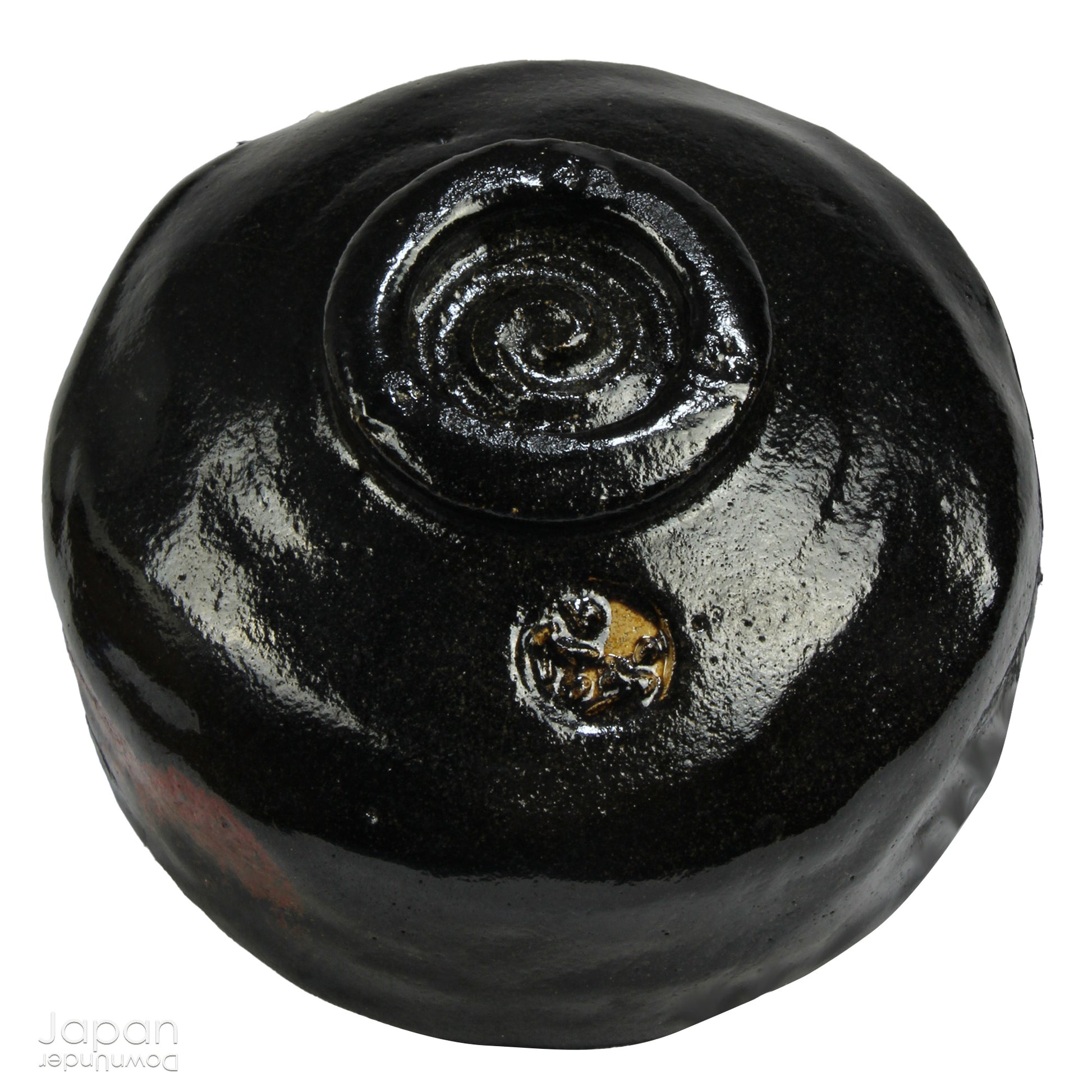 Elevate your tea experience with this stunning vintage black raku ware matcha tea bowl, a timeless work of art that brings both beauty and sophistication to every sip. Handcrafted in Kyoto, Japan, this elegant bowl features a striking contrast between the glossy black glaze and subtle reddish-brown accents that emerge randomly across the surface - each one a testament to the artistry and uniqueness of the raku firing process.