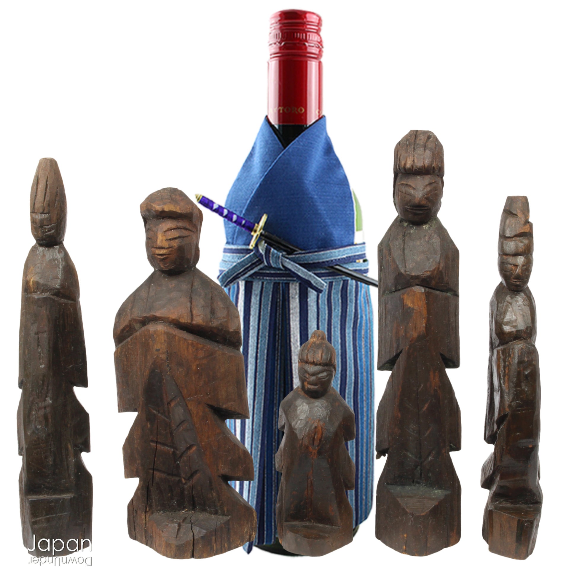 A collection of old hand-carved Enku-style Buddha and Kannon statues.  Enku was a Buddhist monk, much loved for his simple, folk art statues, carved during his many pilgrimages  to the mountains.  These old carvings are made of a light wood.