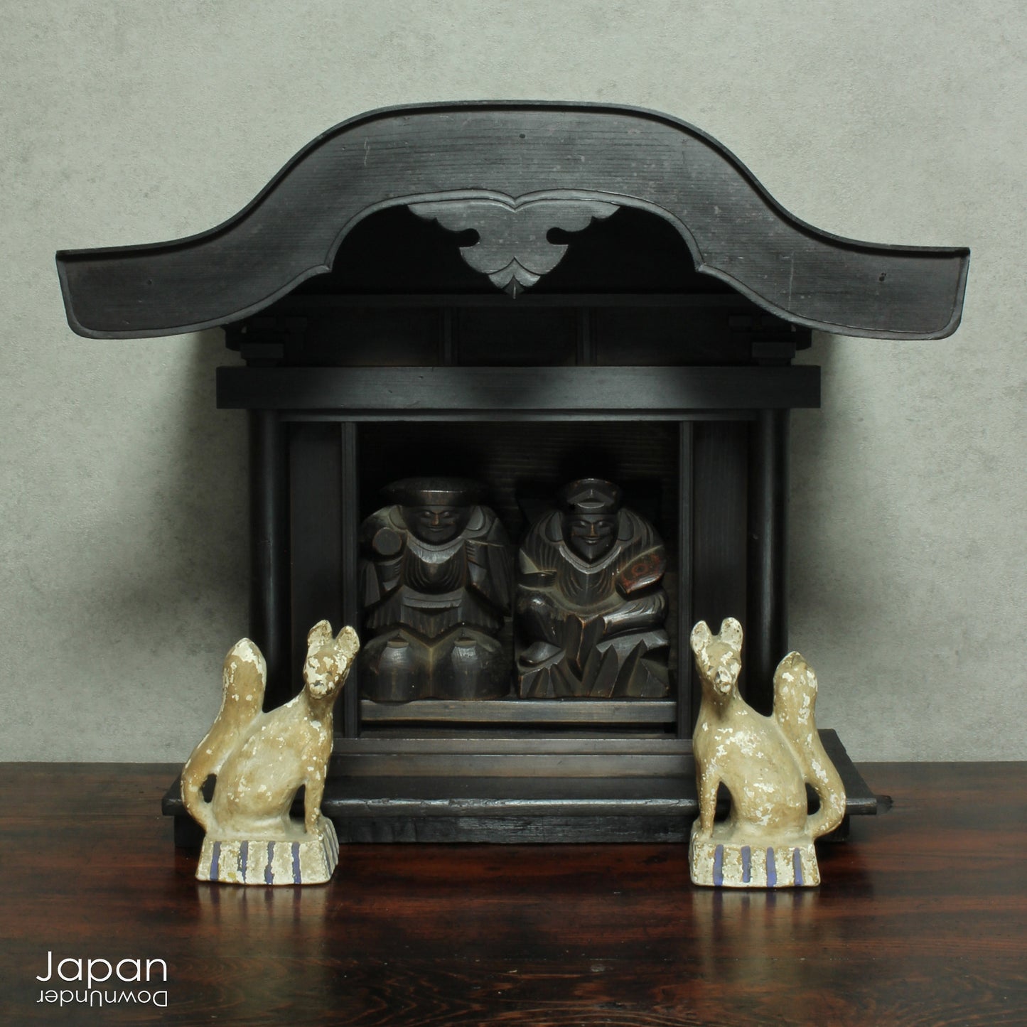 Experience the profound spirituality and artistry of Japan with this authentic Shinto folk faith shrine, dating back to the Meiji era. Perfectly suited for your own kamidana (god shelf) or as a sacred focal point within your home, this antique shrine honors the beloved lucky gods Ebisu and Daikoku - symbols of prosperity, good fortune, and well-being.
