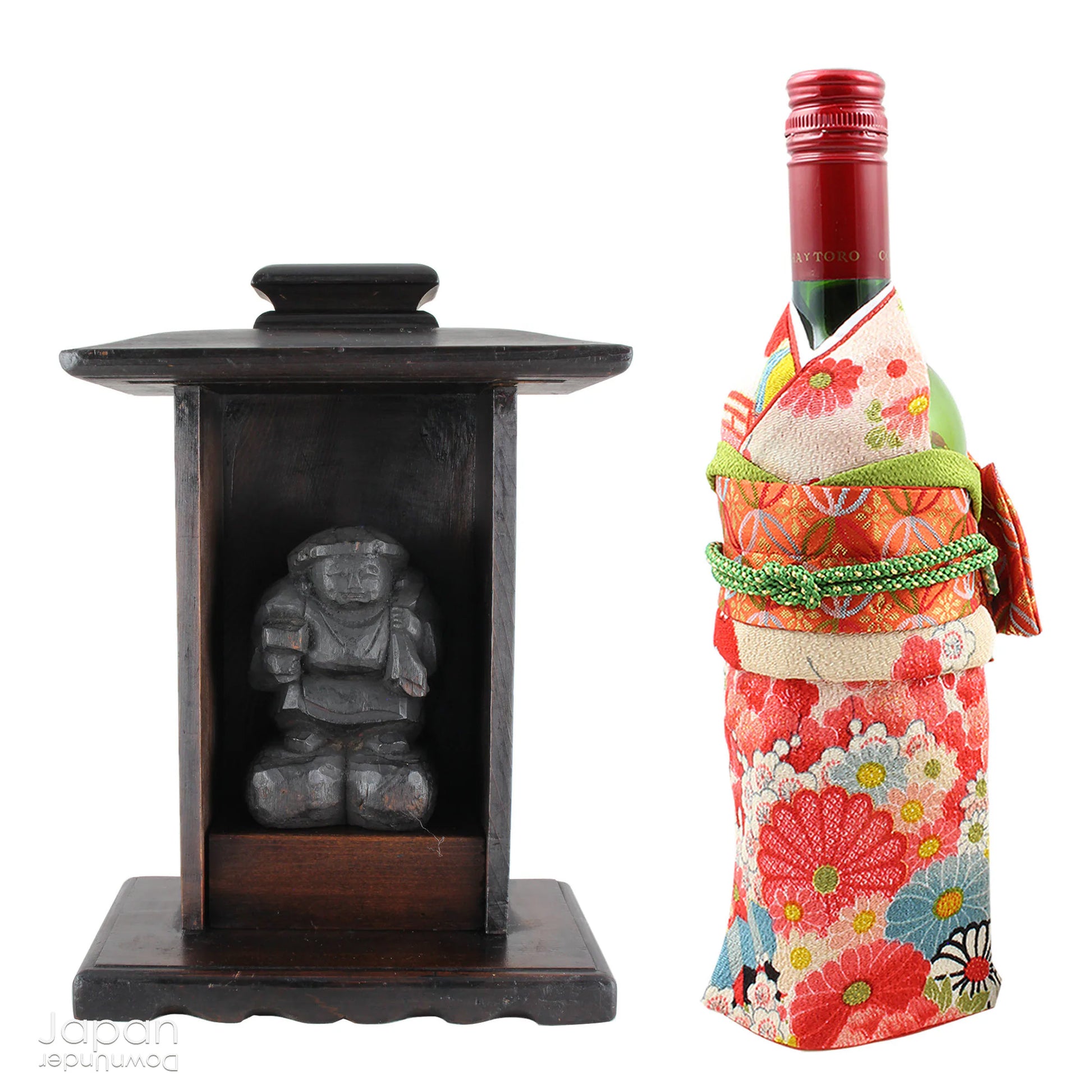 A perfect addition to your spiritual space, this quaint rustic antique Shinto shrine, made to be placed on the kamidana (god shelf), houses the lucky god Daikoku. The charming hand crafted god house embodies the essence of Shinto folk faith, creating an atmosphere of serenity in your home. A meaningful decor piece, that not only celebrates traditional Japanese beliefs but also invites blessings into your home.
