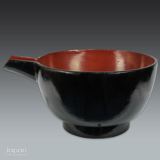 A stunning 1800’s Japanese folk art lacquer sake pourer. This versatile piece doubles as a unique flower vase or beautiful art object, adding a touch of rustic charm to any decor. With the wonderful patina of use, it a truly one-of-a-kind treasure. 
