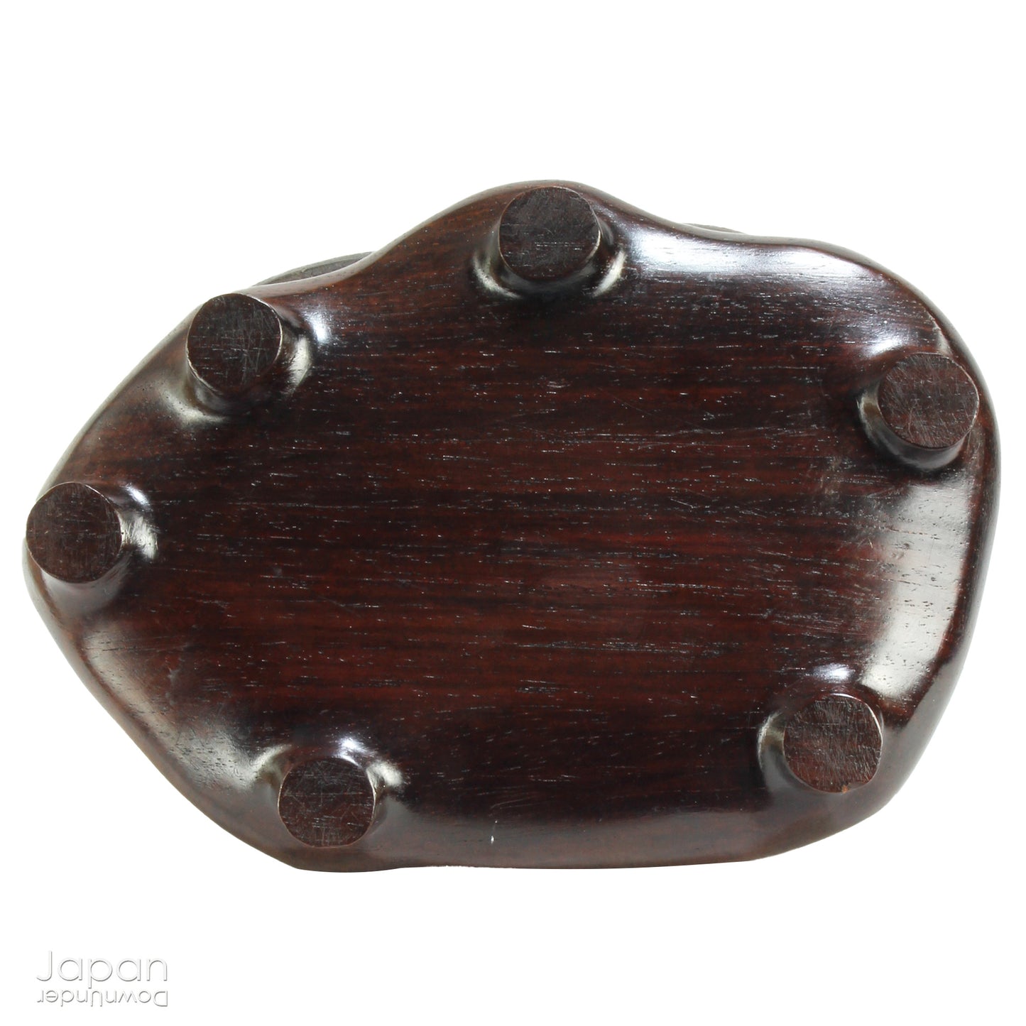 Immerse yourself in the meditative beauty of this captivating miniature suiseki - a traditional Japanese art form where nature is the true sculptor. Gracefully resting on a finely hand-carved ebony daiza (base), this stone embodies stillness and quiet strength, making it an ideal centerpiece for contemplative spaces, creative corners, or serene interiors.