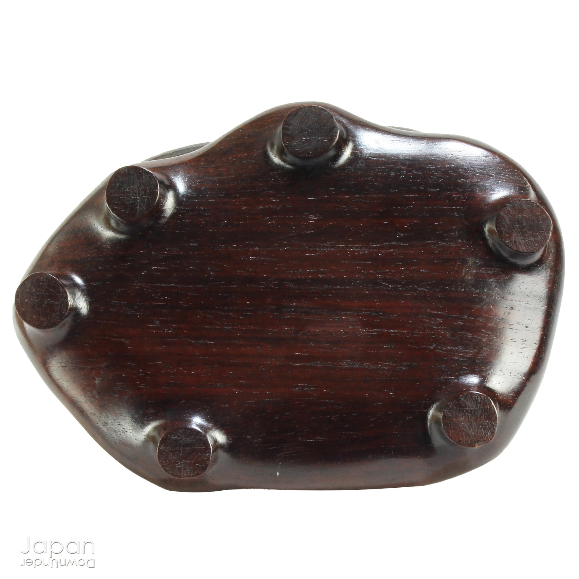 Immerse yourself in the meditative beauty of this captivating miniature suiseki - a traditional Japanese art form where nature is the true sculptor. Gracefully resting on a finely hand-carved ebony daiza (base), this stone embodies stillness and quiet strength, making it an ideal centerpiece for contemplative spaces, creative corners, or serene interiors.