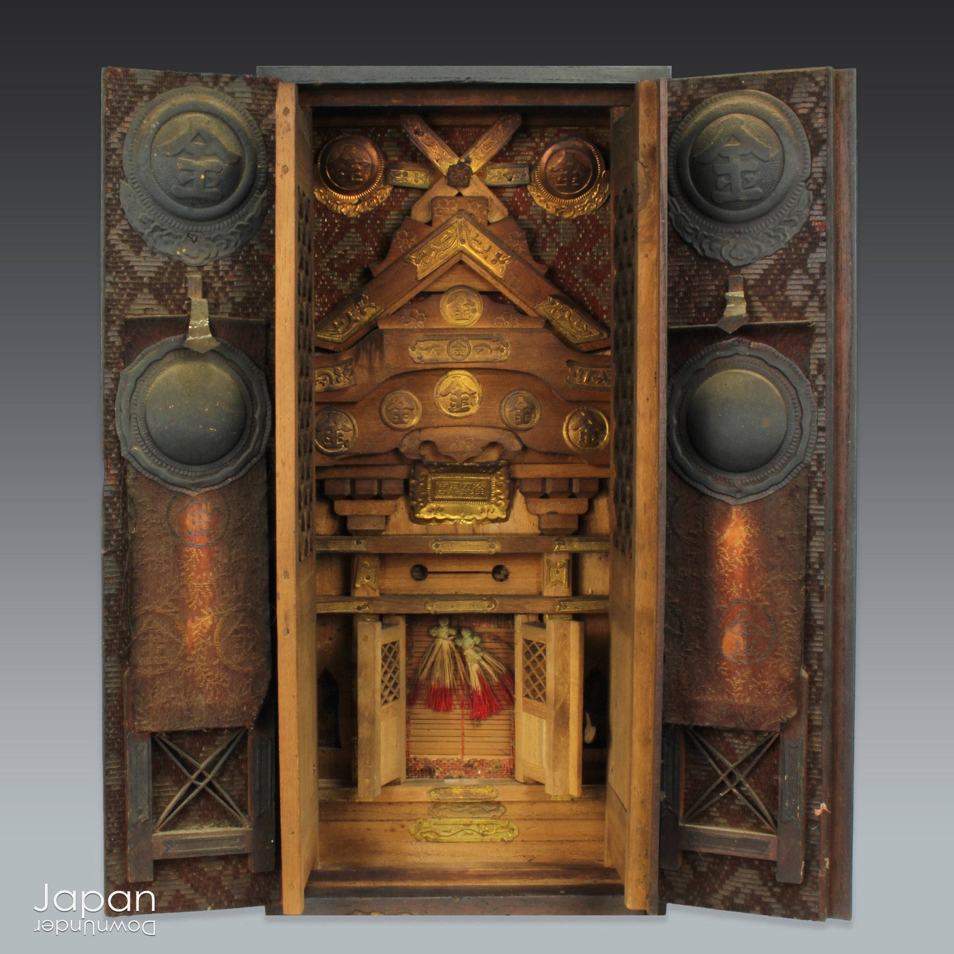 Bring a sense of spiritual heritage and timeless beauty into your space with this rare Meiji era antique Japanese Kamidana Shinto shrine, a scaled-down replica of the revered Konpira Shrine. Steeped in tradition and believed to offer prosperity in business and protection to sea travelers, fishermen, and sailors, this piece carries deep cultural and spiritual significance - a truly unique addition to any home or collection.