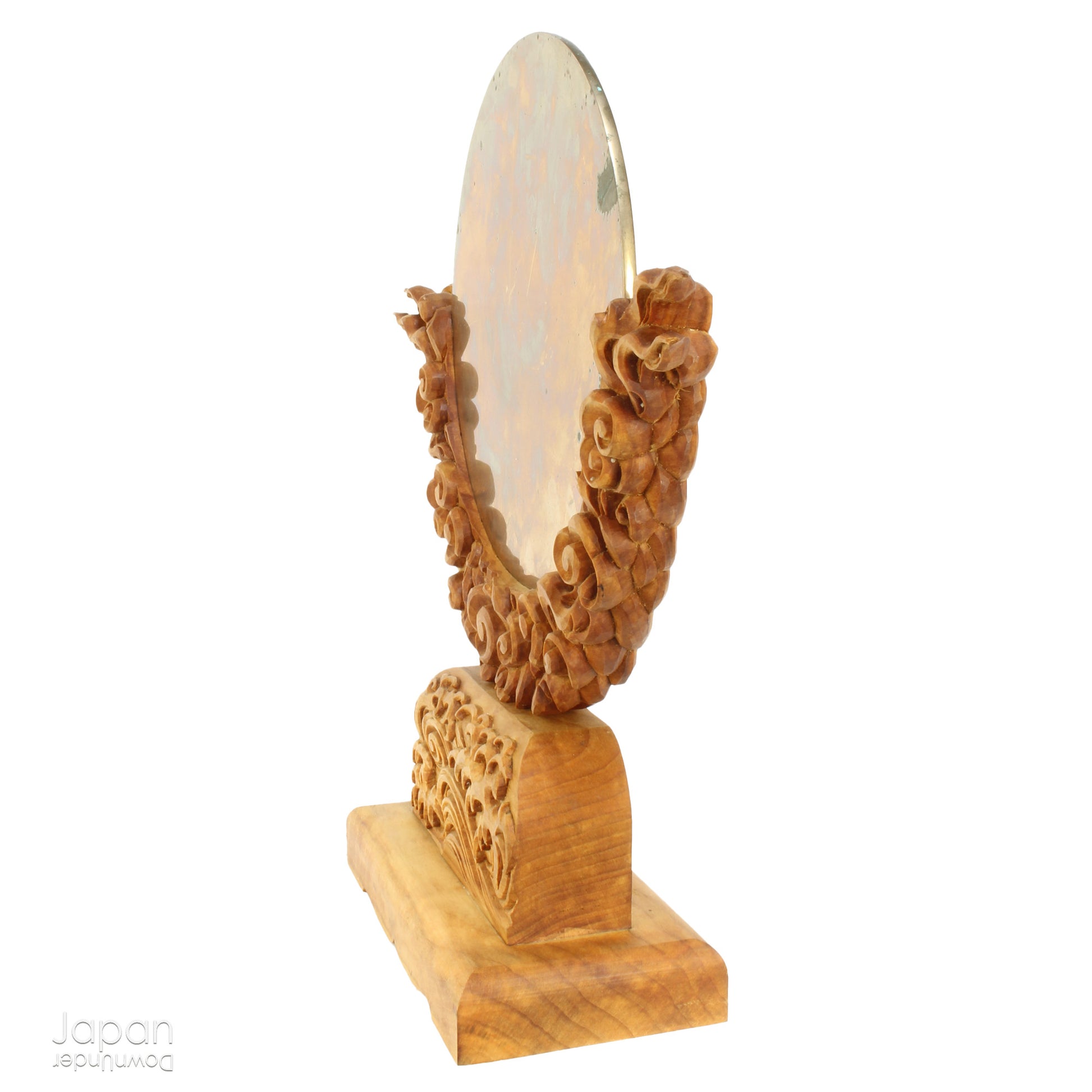Enhance your spiritual space with this majestic rare antique Shinto shrine mirror. Resting on an intricately carved stand, this piece is a unique and beautiful addition to any sacred setting. Invite tranquility and elegance into your home with this spiritual space enhancer.