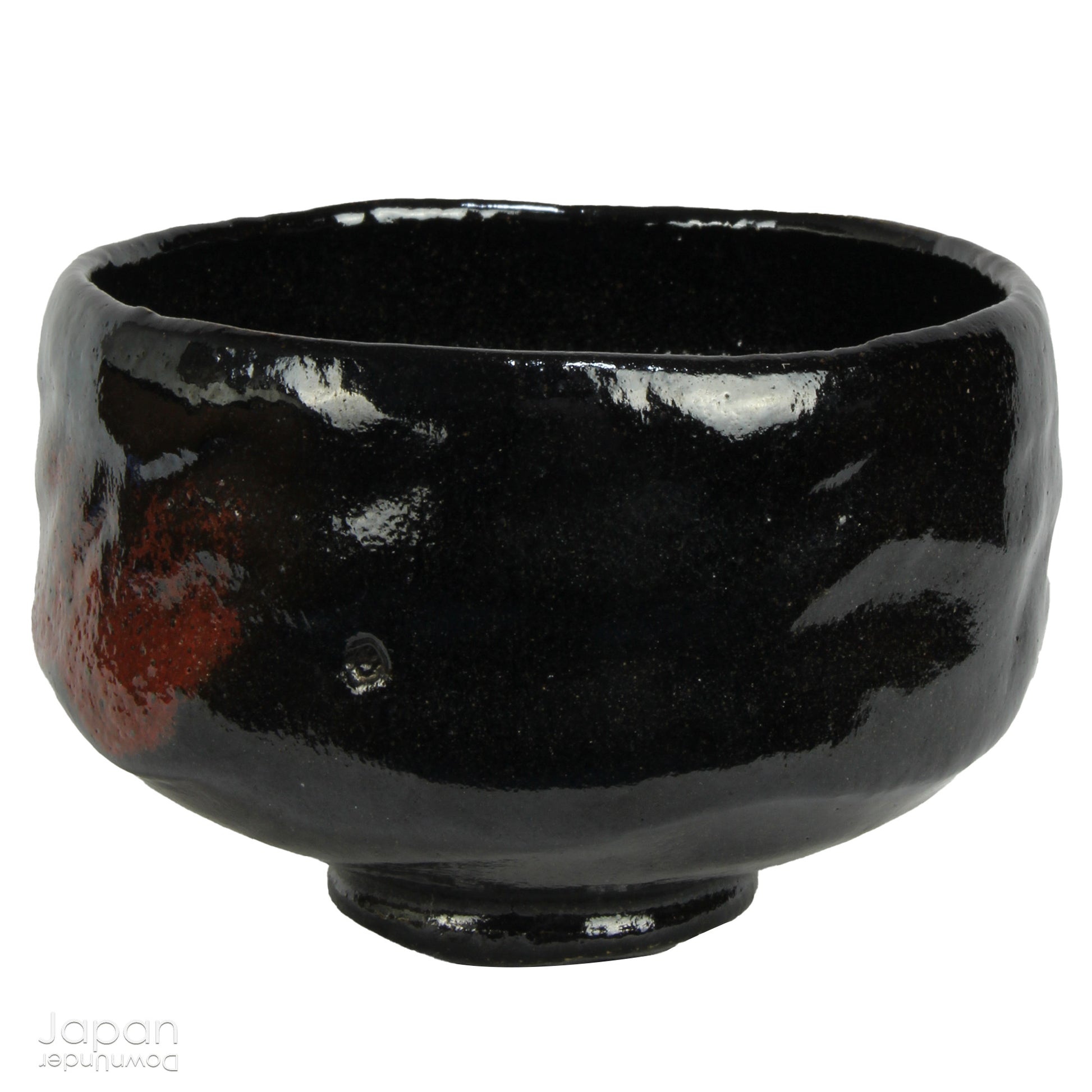Elevate your tea experience with this stunning vintage black raku ware matcha tea bowl, a timeless work of art that brings both beauty and sophistication to every sip. Handcrafted in Kyoto, Japan, this elegant bowl features a striking contrast between the glossy black glaze and subtle reddish-brown accents that emerge randomly across the surface - each one a testament to the artistry and uniqueness of the raku firing process.