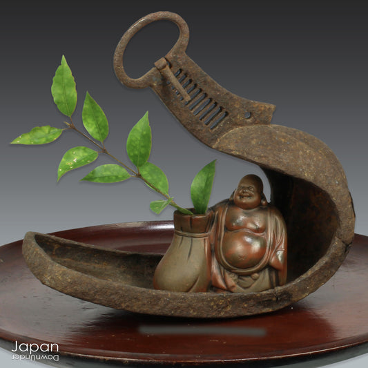 Infuse your home with history and character through this rare vintage treasure -a Japanese samurai horse stirrup, beautifully aged and rusted over time. More than just a historical artifact, this piece doubles as a striking art object and a unique vessel for floral displays, perfect for adding a touch of wabi-sabi charm to your decor.