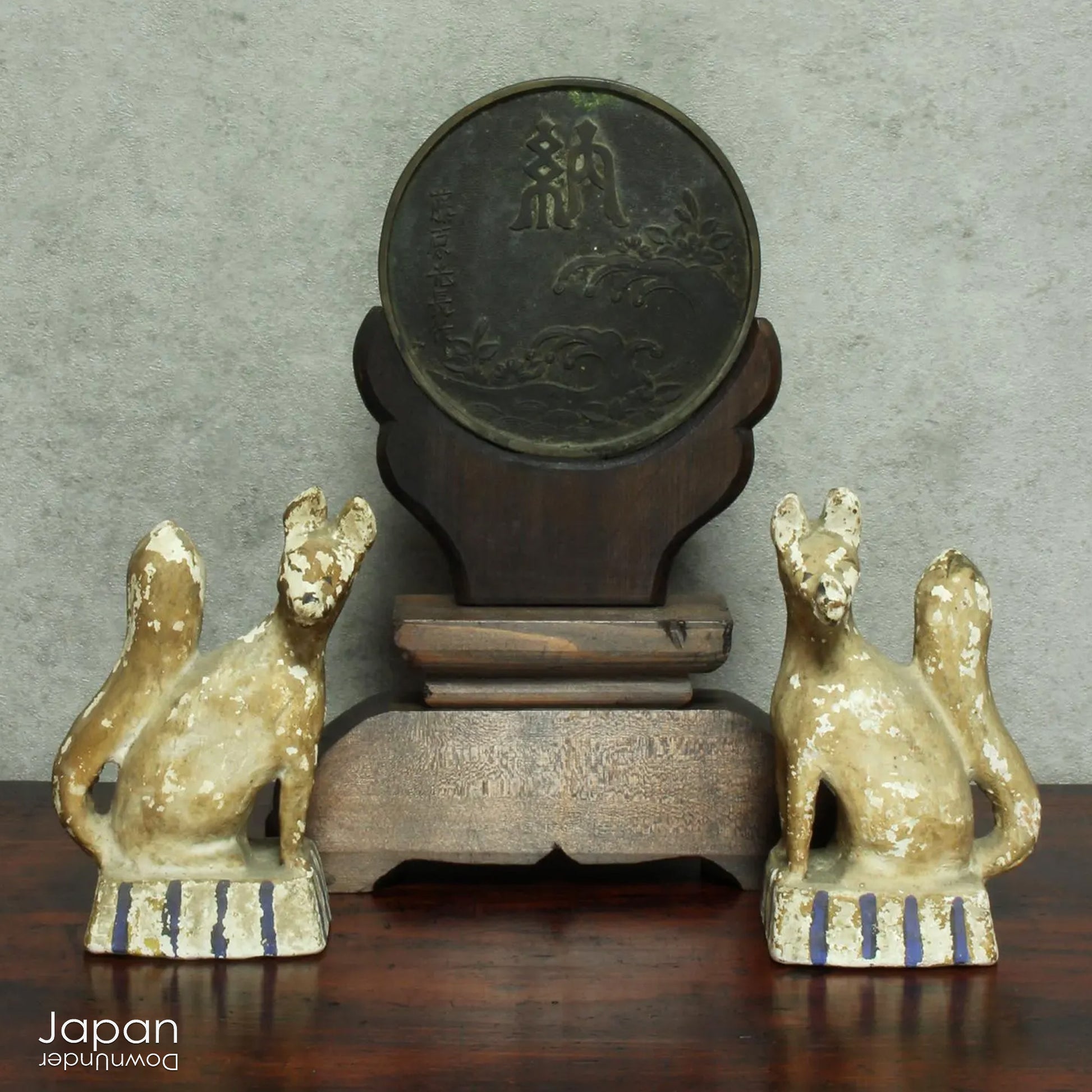 Infuse your spiritual setting with history and reverence through this traditional Japanese Shinto home altar mirror, or shinkyo, set within a hand-carved wooden stand. Once placed on the kamidana - the household altar of a historic Japanese home - this piece carries a deep sense of presence and cultural heritage.