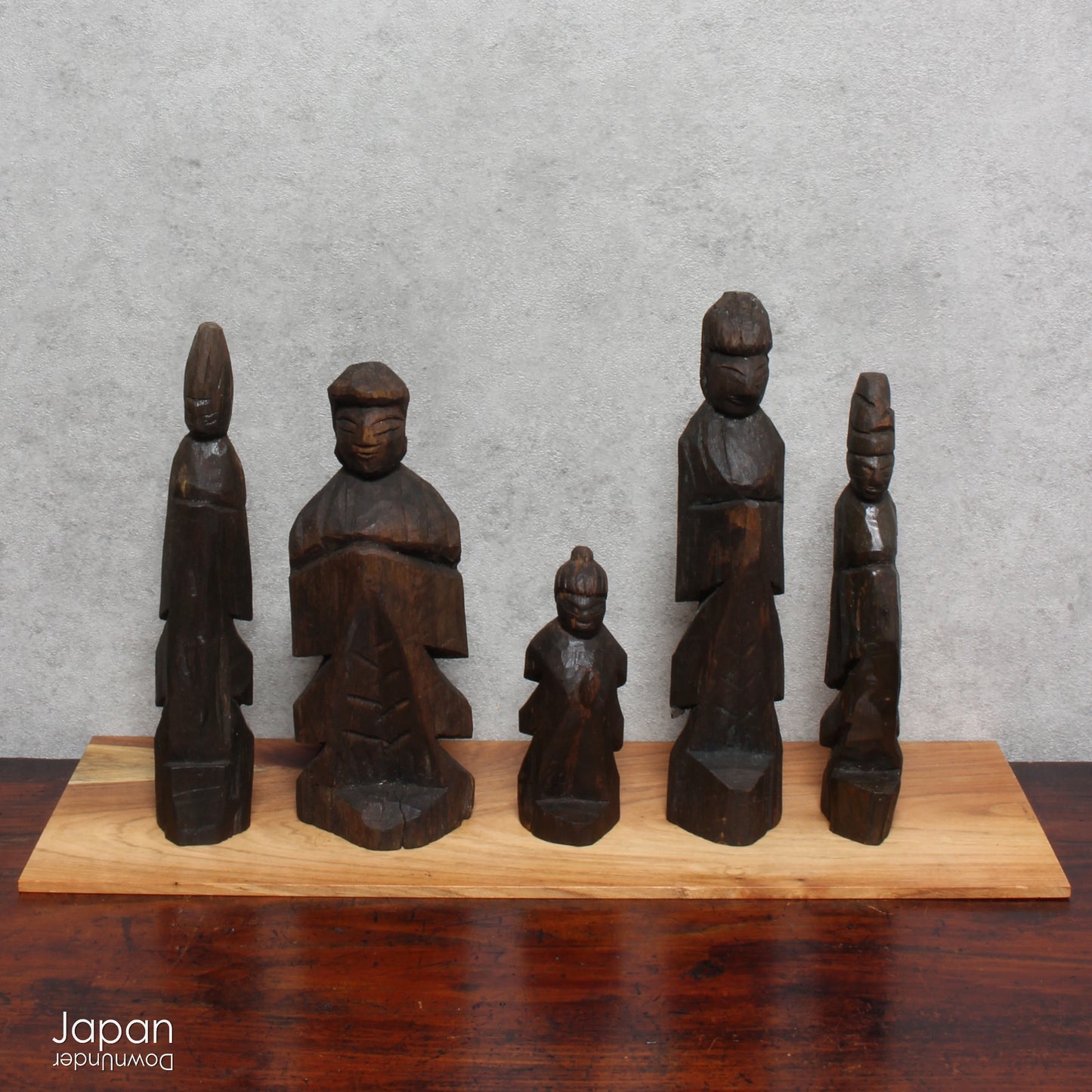 A collection of old hand-carved Enku-style Buddha and Kannon statues.  Enku was a Buddhist monk, much loved for his simple, folk art statues, carved during his many pilgrimages  to the mountains.  These old carvings are made of a light wood.