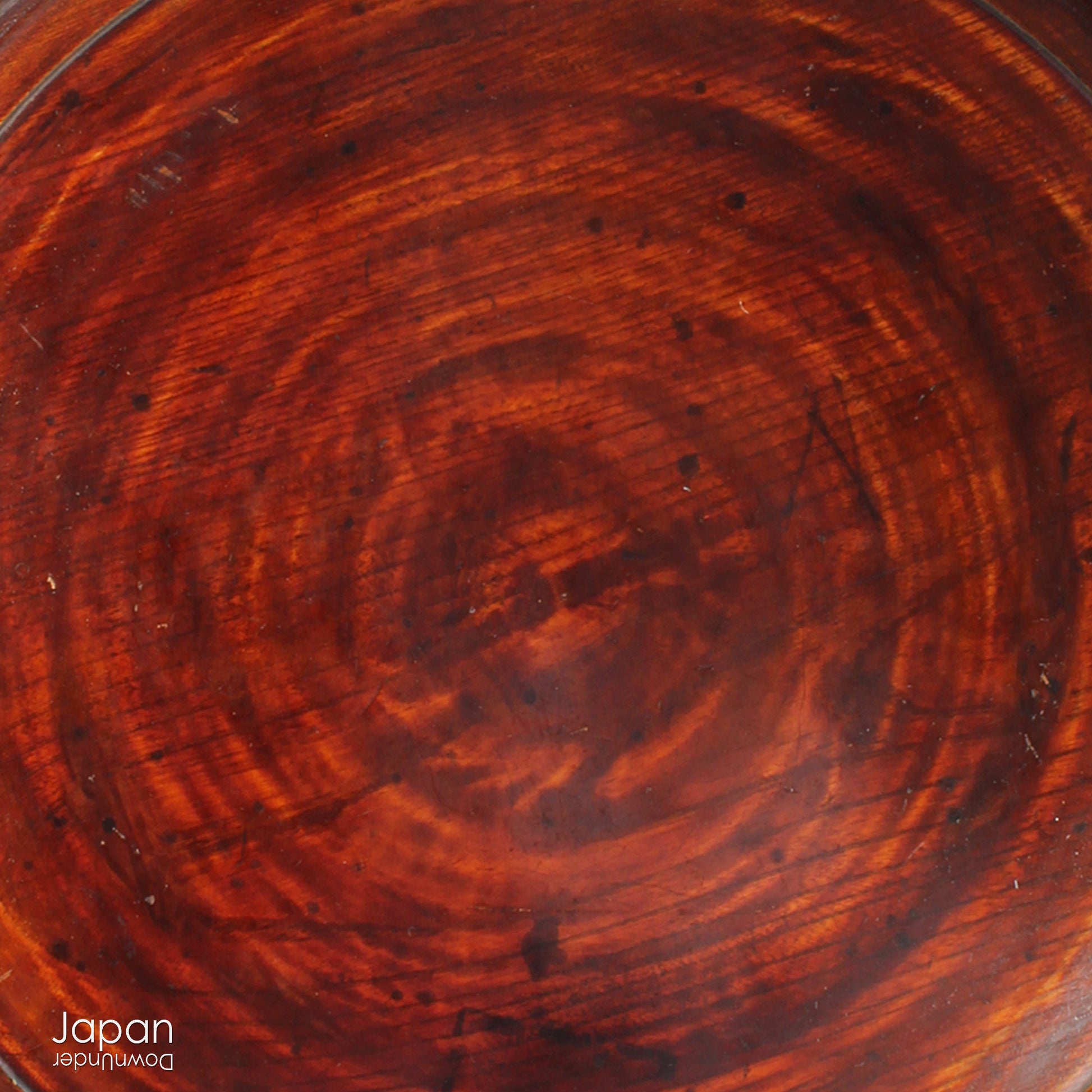 Add timeless charm and rustic elegance to your home with this exceptionally large antique round tea tray, hand-carved from a single cross-section of zelkova (keyaki) wood. A beautiful marriage of form and function, this piece serves equally well as a statement display stand, a unique tabletop, or a traditional tea-serving tray.