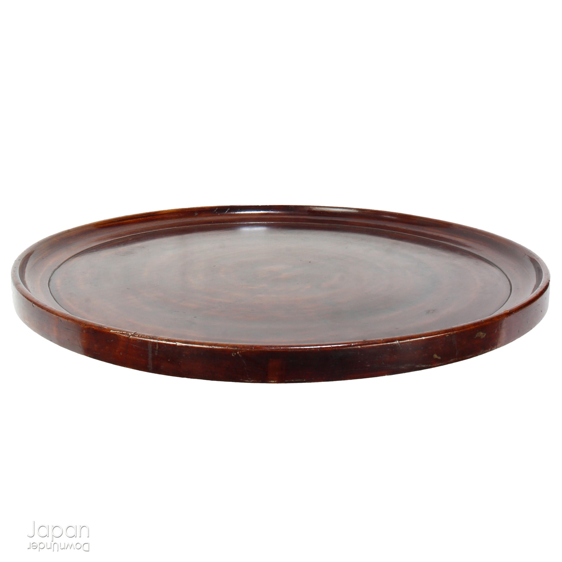 Add timeless charm and rustic elegance to your home with this exceptionally large antique round tea tray, hand-carved from a single cross-section of zelkova (keyaki) wood. A beautiful marriage of form and function, this piece serves equally well as a statement display stand, a unique tabletop, or a traditional tea-serving tray.