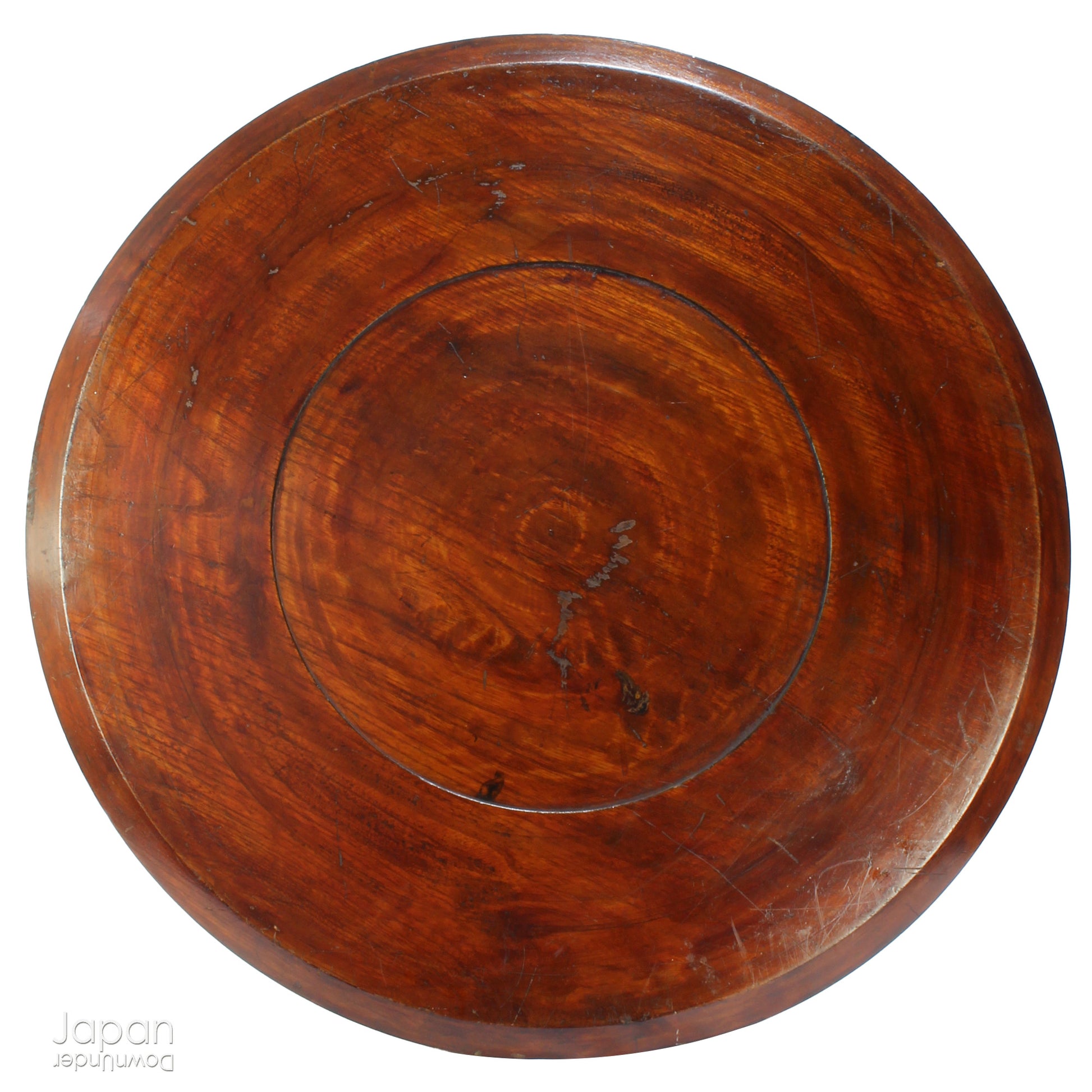 Add timeless charm and rustic elegance to your home with this exceptionally large antique round tea tray, hand-carved from a single cross-section of zelkova (keyaki) wood. A beautiful marriage of form and function, this piece serves equally well as a statement display stand, a unique tabletop, or a traditional tea-serving tray.