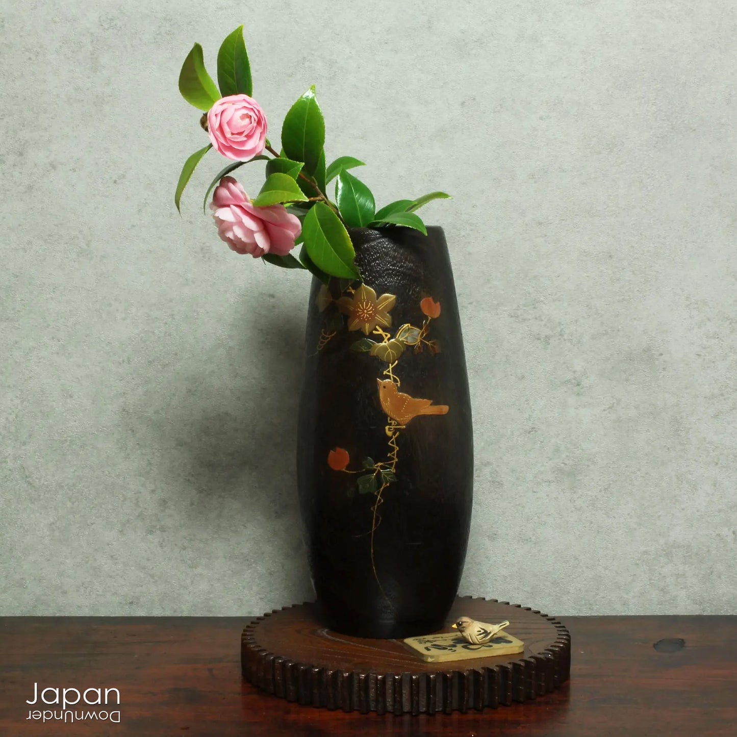 Infuse your space with natural beauty and artisanal charm with this vintage wood vase, adorned with delicate bird and flower motifs in traditional Japanese lacquer. A true celebration of craftsmanship, this handcrafted piece is perfect for displaying fresh seasonal blooms or standing gracefully on its own as a decorative accent.
