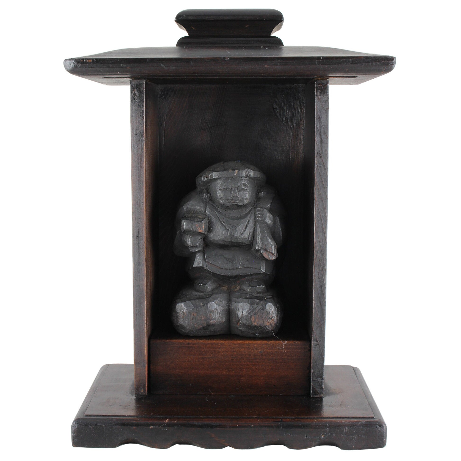 A perfect addition to your spiritual space, this quaint rustic antique Shinto shrine, made to be placed on the kamidana (god shelf), houses the lucky god Daikoku. The charming hand crafted god house embodies the essence of Shinto folk faith, creating an atmosphere of serenity in your home. A meaningful decor piece, that not only celebrates traditional Japanese beliefs but also invites blessings into your home.
